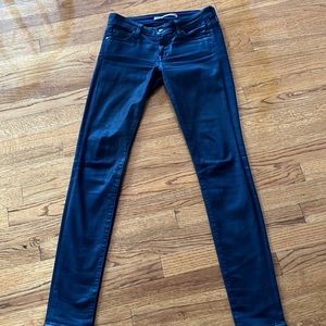 Vince dark blue coated stretch jeans.